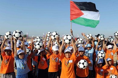 Palestinian children with footballs