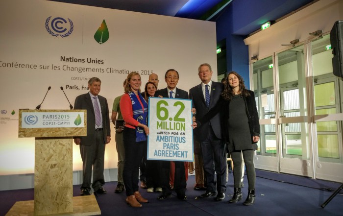 Photo: Ban Ki-moon stands with Nobel Peace Laureate Al Gore during a civil society event 10 December in Paris.